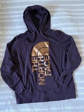 The North Face Purple Hoodie with Gold Logo